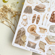 Premium Handmade Sticker Sheet Dark & Light Academia 105mm x 148mm - a sheet on the table with an opened notebook, a white flower branch