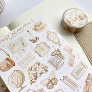 Premium Handmade Sticker Sheet Dark & Light Academia 105mm x 148mm - a washi tape and a sheet on the table with an opened notebook