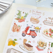 Premium Handmade Sticker Sheet In Love With Italy 105mm x 148mm - a sheet on the table with an opened notebook
