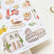 Premium Handmade Sticker Sheet In Love With Italy 105mm x 148mm - a sheet on the table with an opened notebook