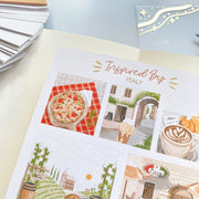 Premium Handmade Sticker Sheet Inspired by Italy 105mm x 148mm - a sheet on the table with an opened notebook