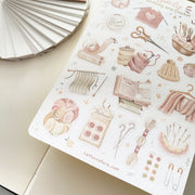 Premium Handmade Sticker Sheet Knitting Crochet 105mm x 148mm - a sheet on the table with an opened notebook
