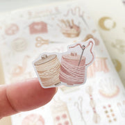 Premium Handmade Sticker Sheet Knitting Crochet 105mm x 148mm - a piece on the finger and a sheet on the table