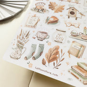 Premium Handmade Sticker Sheet Magical Cozy Fall 105mm x 148mm - a sheet on the table with an opened notebook