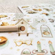 Premium Handmade Sticker Sheet Magical Cozy Fall 105mm x 148mm - a piece and 2 sheets on the table