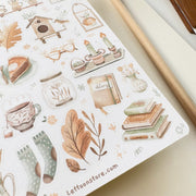 Premium Handmade Sticker Sheet Magical Cozy Fall 105mm x 148mm - a sheet on the table with a pencil