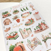 Premium Handmade Sticker Sheet Magical Cozy Winter 105mm x 148mm - a sheet on the table with an opened notebook