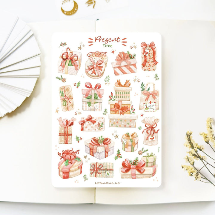 Premium Handmade Sticker Sheet Present Time 105mm x 148mm - a sheet on the table with a white flower branch, an opened notebook