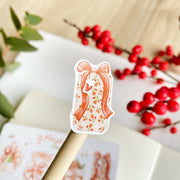 Premium Handmade Sticker Sheet Present Time 105mm x 148mm - a piece on stick and a sheet on the table with a red berry branch, an opened notebook