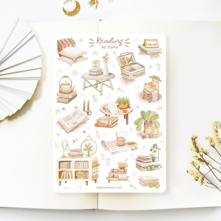 Premium Handmade Sticker Sheet Reading at Home 105mm x 148mm - a sheet on the table with a white flower branch, an opened notebook