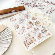 Premium Handmade Sticker Sheet Reading at Home 105mm x 148mm - a sheet on the table with a dark maroon flower branch, an opened notebook, a pencil, a ruler
