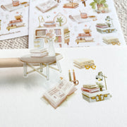 Premium Handmade Sticker Sheet Reading at Home 105mm x 148mm - a piece on the stick and 3 pieces and 2 sheets on the table with a dark maroon flower branch, an opened notebook, a pencil, a ruler