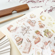 Premium Handmade Sticker Sheet Reading at Home 105mm x 148mm - a sheet on the table with a dark maroon flower branch, an opened notebook, a pencil, a ruler