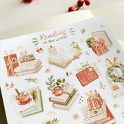 Premium Handmade Sticker Sheet 
Reading in the Winter 105mm x 148mm - a sheet on the table with a red berry branch