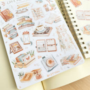 Premium Handmade Sticker Sheet Reading Time 105mm x 148mm - a sheet on the table with an opened notebook