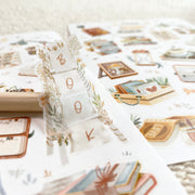 Premium Handmade Sticker Sheet Reading Time 105mm x 148mm - a piece and 2 sheets on the table with an opened notebook 
