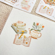 Premium Handmade Sticker Sheet Reading Time 105mm x 148mm - 3 pieces and 2 sheets on the table with an opened notebook 