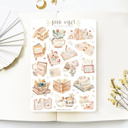 Premium Handmade Sticker Sheet Reading Time 105mm x 148mm - a sheet on the table with a white flower branch, an opened notebook