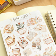 Premium Handmade Sticker Sheet Reading Time 105mm x 148mm - a sheet on the table with the opened notebook