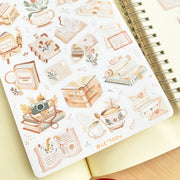 Premium Handmade Sticker Sheet Reading Time 105mm x 148mm - a sheet on the table with an opened notebook