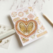 Premium Handmade Sticker Sheet Romantic Flower 105mm x 148mm - a piece and a sheet on the table with a pencil