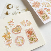 Premium Handmade Sticker Sheet Romantic Flower 105mm x 148mm - 6 pieces and a piece and a sheet on the table 