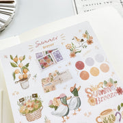 Premium Handmade Sticker Sheet Summer Breeze 105mm x 148mm - a sheet on the table with an opened notebook