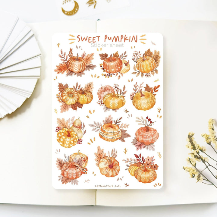 Premium Handmade Sticker Sheet Sweet Pumpkin 105mm x 148mm - a sheet on the table with a white flower branch, an opened notebook