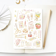 Premium Handmade Sticker Sheet The Art of Summer 105mm x 148mm - a sheet on the table with a pencil, an opened notebook