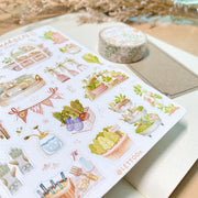 Premium Handmade Sticker Sheet 
Veggie Garden 105mm x 148mm - a sheet on the table with a white flower branch, an opened notebook, a washi tape