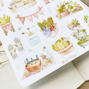 Premium Handmade Sticker Sheet 
Veggie Garden 105mm x 148mm - a sheet on the table with an opened notebook