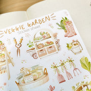 Premium Handmade Sticker Sheet 
Veggie Garden 105mm x 148mm - a sheet on the table with an opened notebook