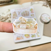 Premium Handmade Sticker Sheet 
Veggie Garden 105mm x 148mm - a piece and a sheet on the table with a white flower branch, an opened notebook, a washi tape in the background