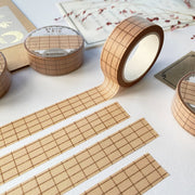 Premium Handmade Washi Tape Brown Grid 15mm x 10m - 4 pieces and 4 washi tapes on the table with a dark maroon flower branch, a chapter heading, a sticker sheet