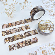 Premium Handmade Washi Tape Butterfly 15mm x 10m - 4 pieces and 2 washi tapes and 2 sticker sheets on the table with a white flower branch