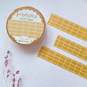 Premium Handmade Washi Tape Butterscotch Grid 15mm x 10m - 3 pieces and a washi tape on the table with a dark maroon flower branch