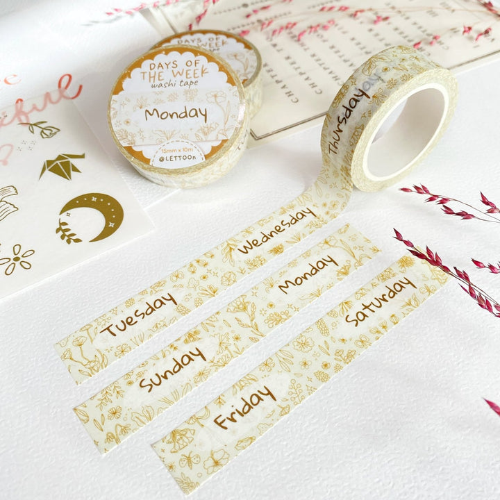 Premium Handmade Washi Tape Days of The Week 15mm x 10m - 3 pieces and 3 washi tapes on the table with 2 pink flower branches, a heading chapter, a sticker sheet