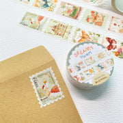 Premium Handmade Washi Tape Dreamy Stamp 25mm x 5m - 2 pieces and a washi tape on the table with a branch, an envelope, a notebook