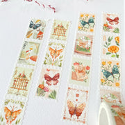 Premium Handmade Washi Tape Dreamy Stamp 25mm x 5m - 4 pieces and 1 washi tapes on the table with a pink flower branch, a notebook