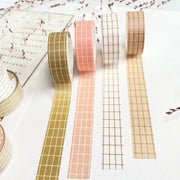 Premium Handmade Washi Tape 
Gridtastic 15mm x 10m - 4 pieces and 7 washi tapes on the table with a dark maroon flower branch, a chapter heading