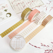 Premium Handmade Washi Tape 
Gridtastic 15mm x 10m - 4 pieces and 5 washi tapes on the table with 2 dark maroon flower branches, a chapter heading, a sticker sheet