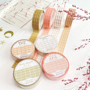 Premium Handmade Washi Tape 
Gridtastic 15mm x 10m - 4 pieces and 8 washi tapes on the table with 2 dark maroon flower branches, a chapter heading, a sticker sheet