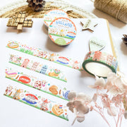 Premium Handmade Washi Tape Hallo Holland 15mm x 10m - 4 pieces and 3 washi tapes on the table with a white hydrangea flower branch, 2 wood stars, a wood heart, a wood gift, a round sedge weave, an acorn