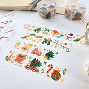 Premium Handmade Washi Tape Happy Holidays 20mm x 10m - 4 pieces and 3 washi tapes on the table with a dark maroon flower branch, a notebook