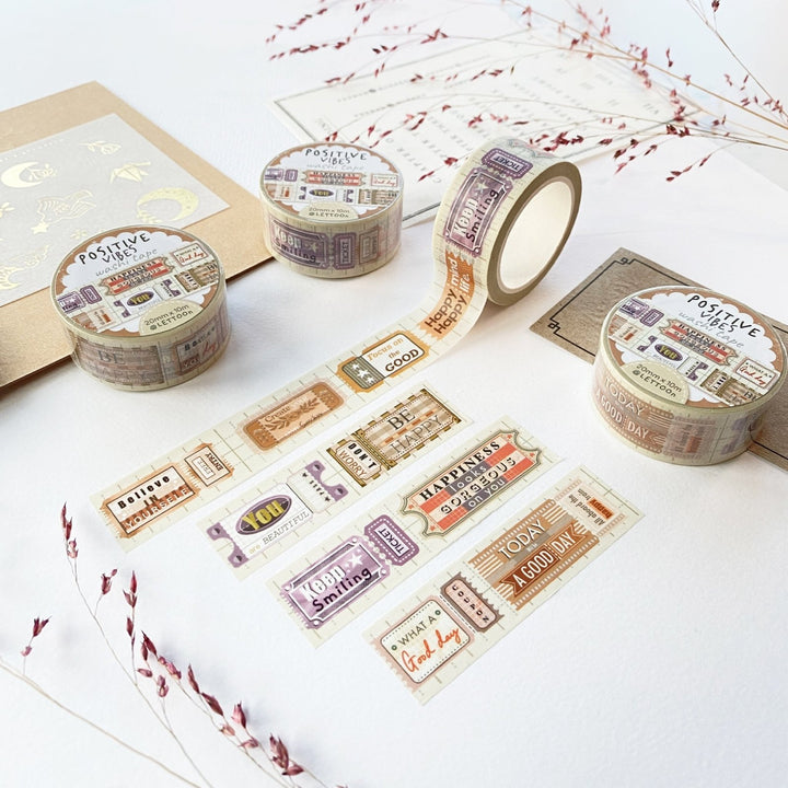 Premium Handmade Washi Tape Positive Vibes 15mm x 10m - 4 pieces and 4 washi tapes on the table with a dark maroon flower branch