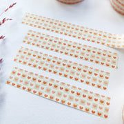 Premium Handmade Washi Tape Warm Heart 15mm x 10m - 4 pieces on the table with a dark maroon flower branch