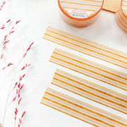 Premium Handmade Washi Tape Warm Line 15mm x 10m - 4 pieces and 2 washi tapes on the table with a dark maroon flower branch