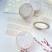 Premium Handmade Washi Tape White & Brown Grid 15mm x 10m - 3 pieces and 4 washi tapes on the table with a dark pink flower branch, a chapter heading, a sticker sheet