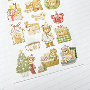 Close-up of Beary Winter stickers on textured paper: Christmas socks that say Beary Christmas