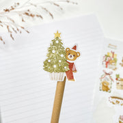Beary Winter kiss-cut sticker on a pencil: a bear peeking from behind a Christmas tree